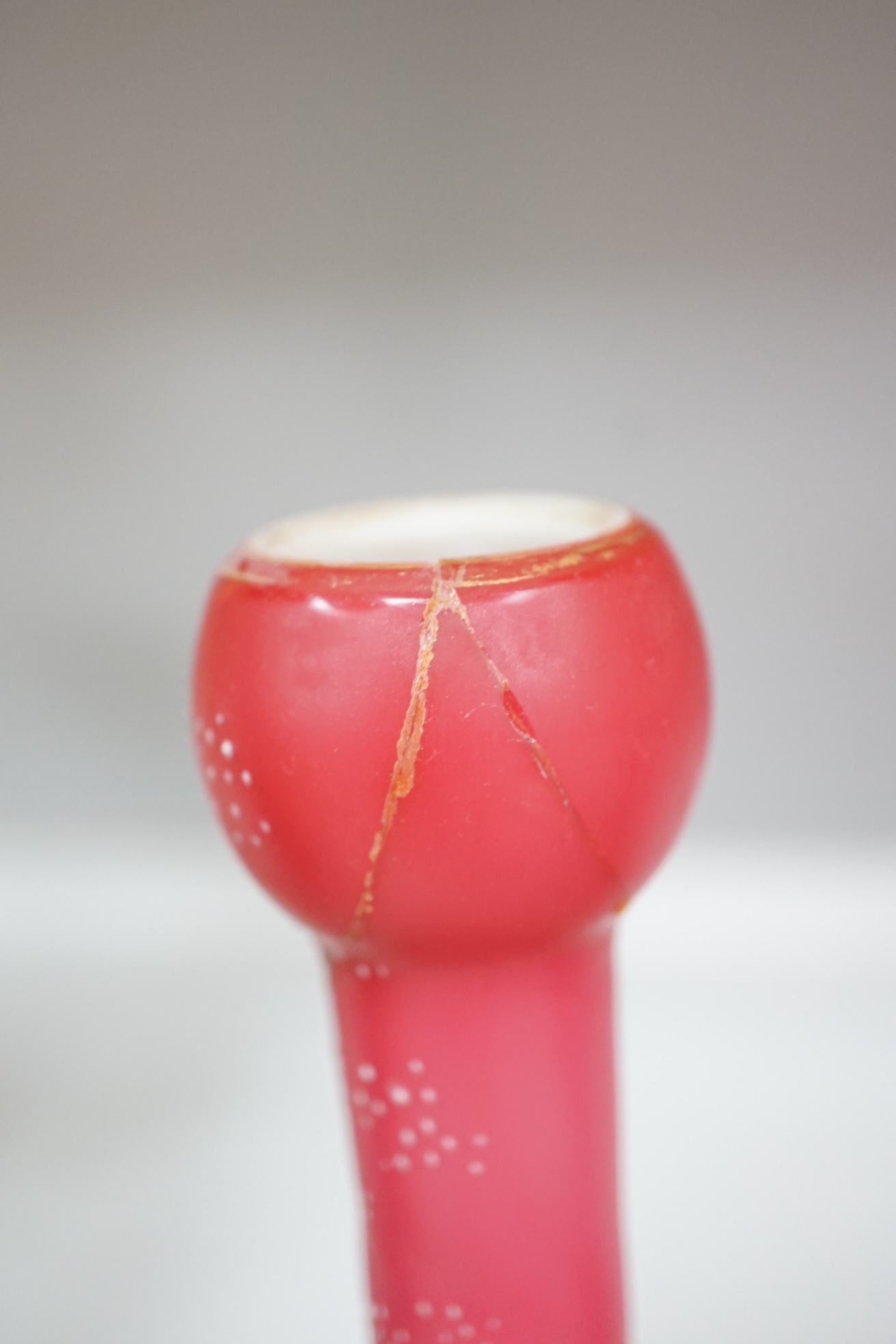 A pair of Victorian pink satin long necked vases, 25cm high, and five pieces of cranberry coloured glassware, (8). Condition - fair to good.